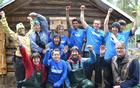 SCA Trail Crew celebrates their work on the trail from the historic cabin.
