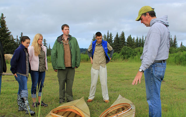 Aqua Kids learn about constrution of traditional native kayaks from Ageya Director