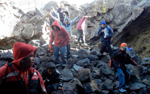 Students entering cave