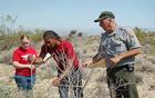 High School students learn vegetation transect methods from park biologist