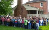 A group of 5th grade students display their National Parks Passport booklets