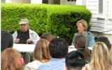 Harry Middleton and Bess Able seated in front of students