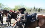 Living Historian standing by his horse