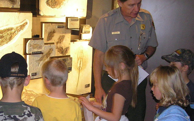 2nd grade students learn about fossilized fish from Ranger John