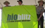 Rocky Mountain Acting Superintendent accepting the Bioblitz flag from Saguaro Superintendent and a represenative from National Geographic 