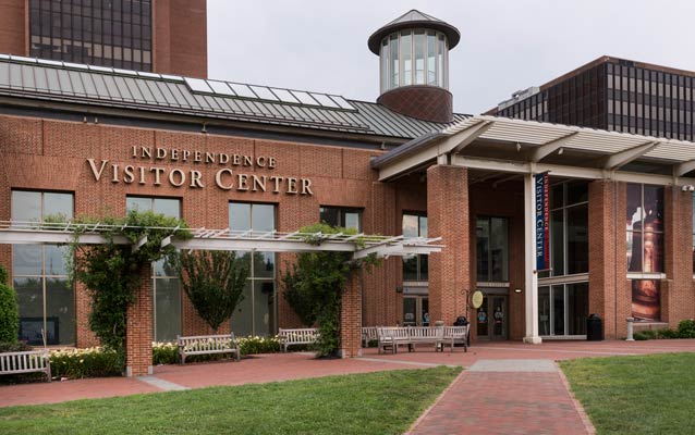 Exterior of Independence Visitor Center, a brick building prominently displaying the words
