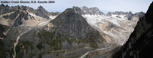 image of a small glacier near a rocky mountain