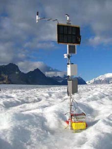a solar panel and other metal equipment on a glacier