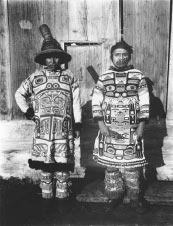 photograph of two Alaska Native men wearing traditional clothing