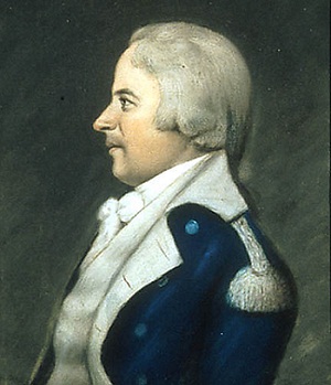 profile portrait of white haired man in blue with white trim military uniform