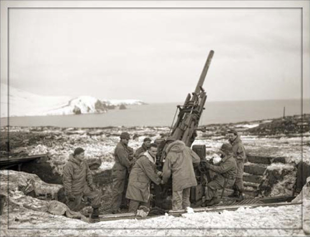Soldiers stand around a large gun.