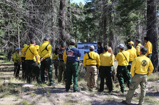 A fire ecology crew member discusses the factors that can contribute to fire severity