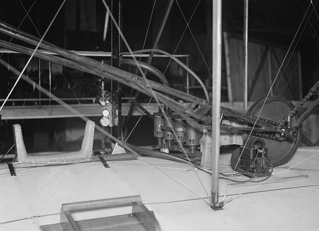 Restored Wright Flyer cockpit, showing hip cradle, instruments, and engine- 1928