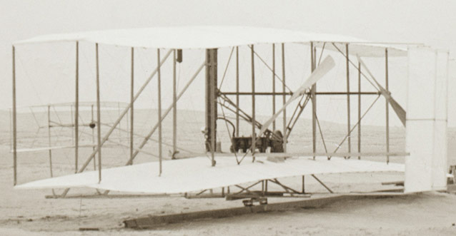 Wright Flyer showing elevator, engine, propellers, and rudder (L to R)- Kitty Hawk, 1903