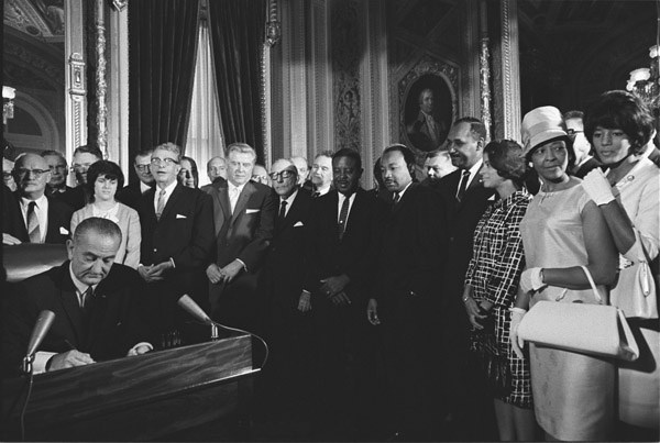 President Lyndon B. Johnson signs the Voting Rights Act