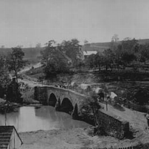Photograph of Union supply wagons crossing the Middle Bridge over the Antietam Creek after the battle.