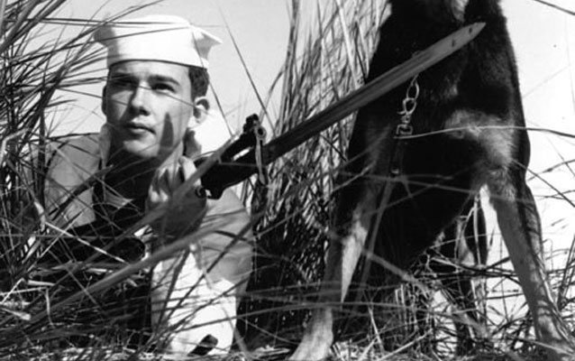 Coast Guardsman patrolling beaches during WWII