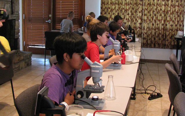 students using microscopes