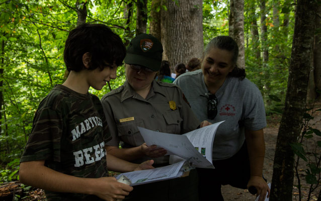 Student working with Ranger to collect data