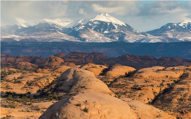 Desert sandstones and snow-capped mountains