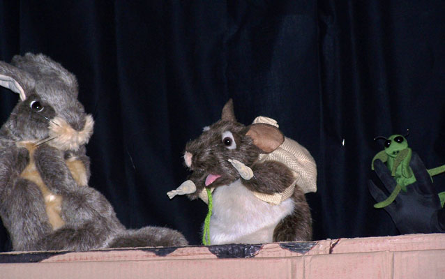 puppet show in progress with rabbit, pack rat, and mantis