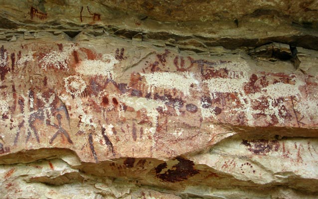 Grand Canyon rock art depicting hunters (left) and game animals.