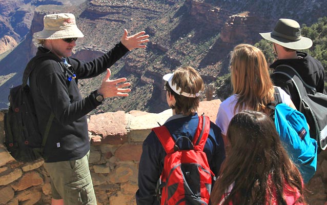 Tour guide educating public on rim of Grand Canyon