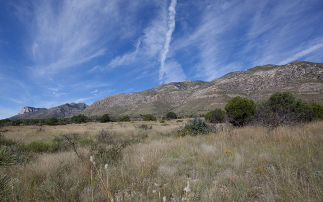 The Frijole Ridge, part of the Capitan Reef, rises above the dry landscape.