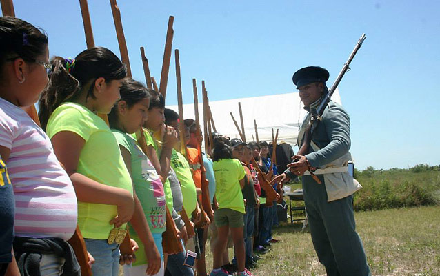 A Ranger leads a group through the musket drill.