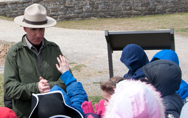 A ranger takes a question from a 4th grader