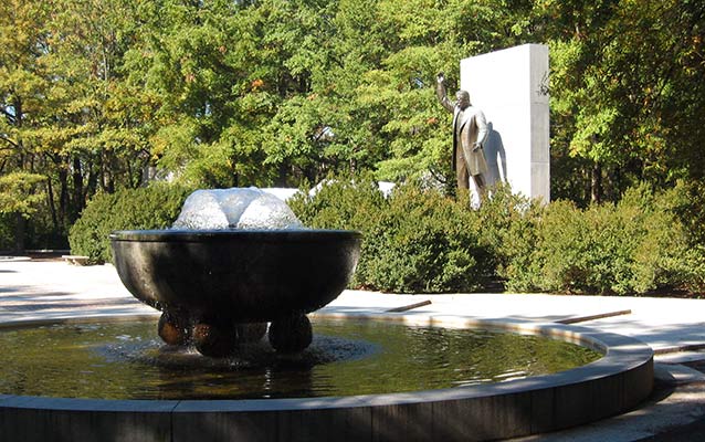 Memorial plaza with fountain and statue of Theodore Roosevelt