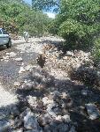 Maintenance worker assesses damage