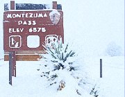 Elevation sign at Montezuma Pass (6575 ft.) in deep snow.