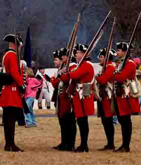 Members of the 7th Regiment British reenanctors practice their weapons drill.
