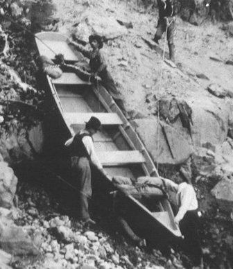 Lowering the boat Cleetwood to study Crater Lake