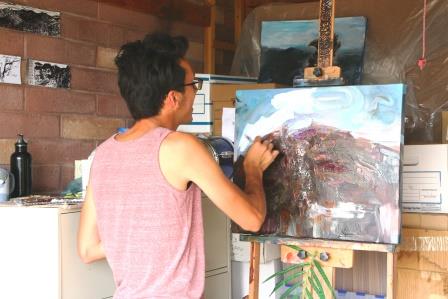 Artist painting the Craters of the Moon landscape