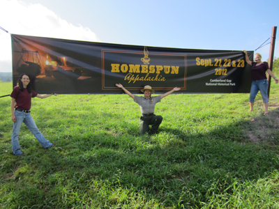 Park Rangers and park partners in front of Homespun Appalachia banner