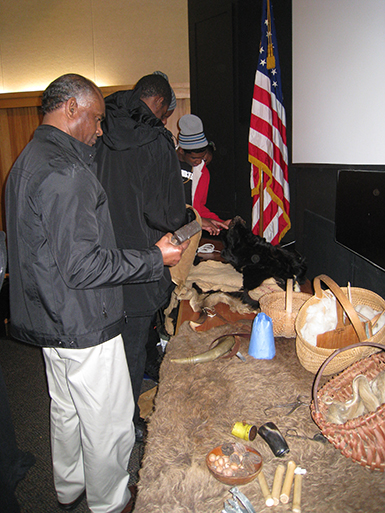 visitors from Barbados looking at exhibit at Cumberland Gap National Historical Park