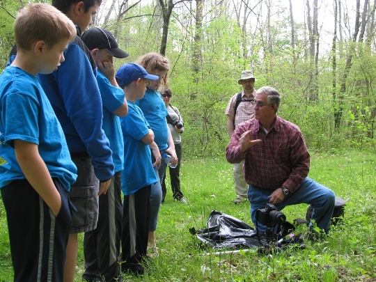 Volunteer Harold Jerrell teaches park visitors about the great outdoors