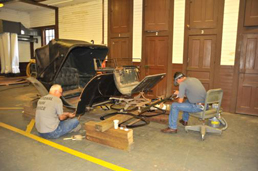 Cumberland Island National Seashore Curator John Mitchell and Conservator Al Levitan work to conserve a carriage in the Cumberland Island collection.