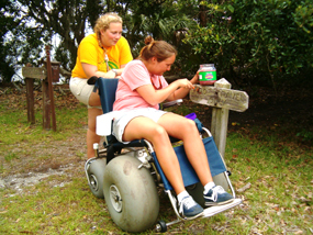 Cumberland Island volunteers assist in the upkeep of painting various trail signs.