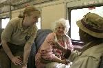 07 Volunteer Talks to Passengers