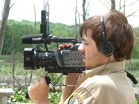 Volunteer intern Lacy Tilley filming at the Beaver Marsh
