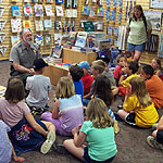 Ranger with kids at the Huffman Prairie Flying Field Interpretive Center.