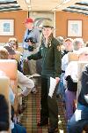 A ranger speaks with visitors on the Alaska Railroad, en route to Denali
