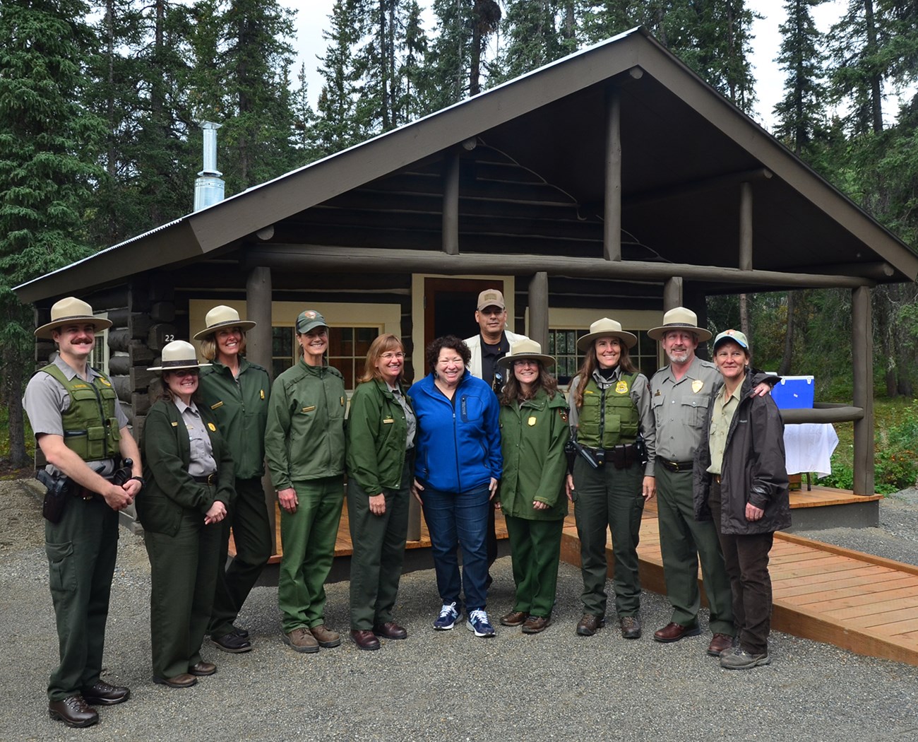 uniformed park rangers posing for a group photo with a supreme court justice