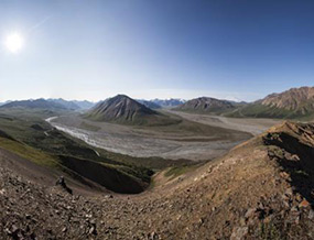 View from atop a ridge, mountains and valleys in the distance