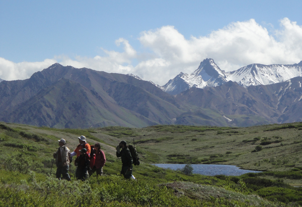Visitors and a ranger hiking