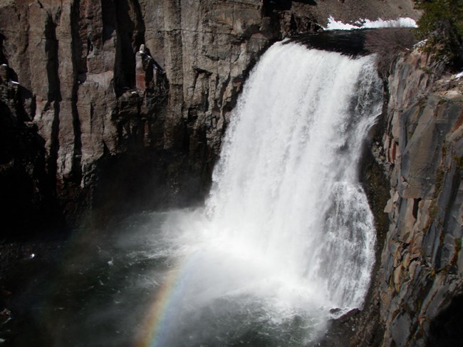 Rainbow Falls plunges over a cliff.