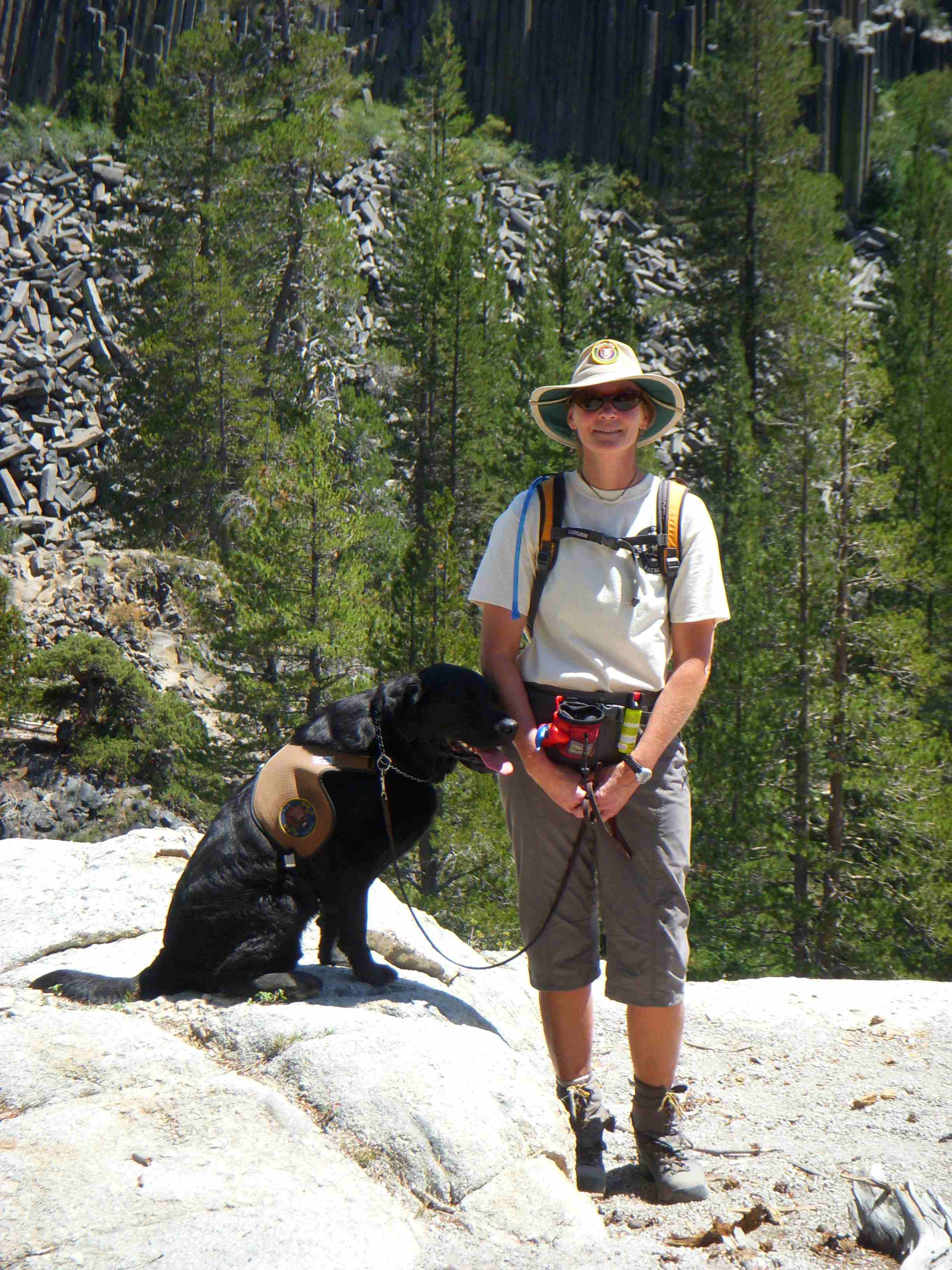 Volunteer Laura patrols the John Muir Trail with her dog Frasier